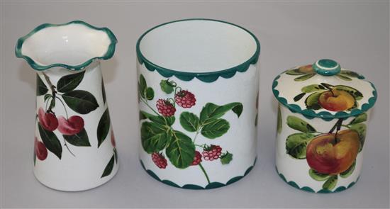 A Wemyss preserve pot and cover, a similar vase and a cylindrical pot, early 20th century, 12cm, preserve cover with restorations